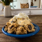 plate full of ice cream, cookie dough and whipped topping