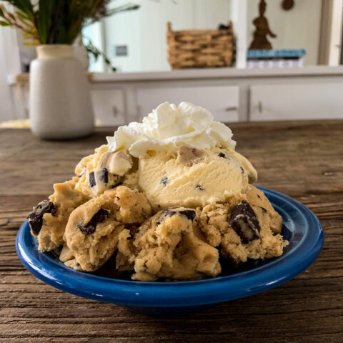 plate full of ice cream, cookie dough and whipped topping