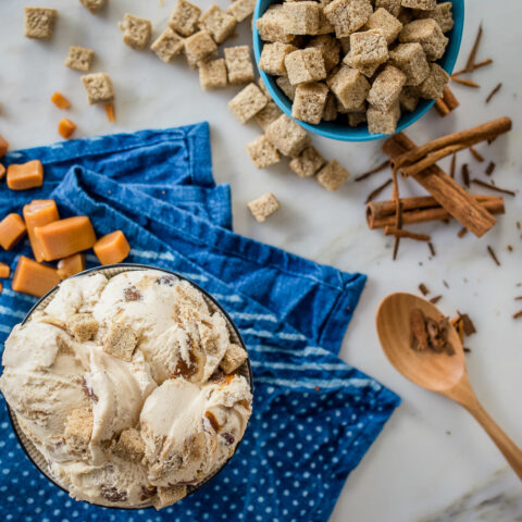 bowl of ice cream with cinnamon, caramel and baked pieces