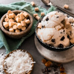 bowl of ice cream with coconut and cookie dough inclusions