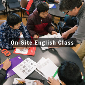 English language learners sitting around a table working