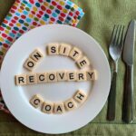 on-site recovery coach spelled out in scrabble letters on a plate